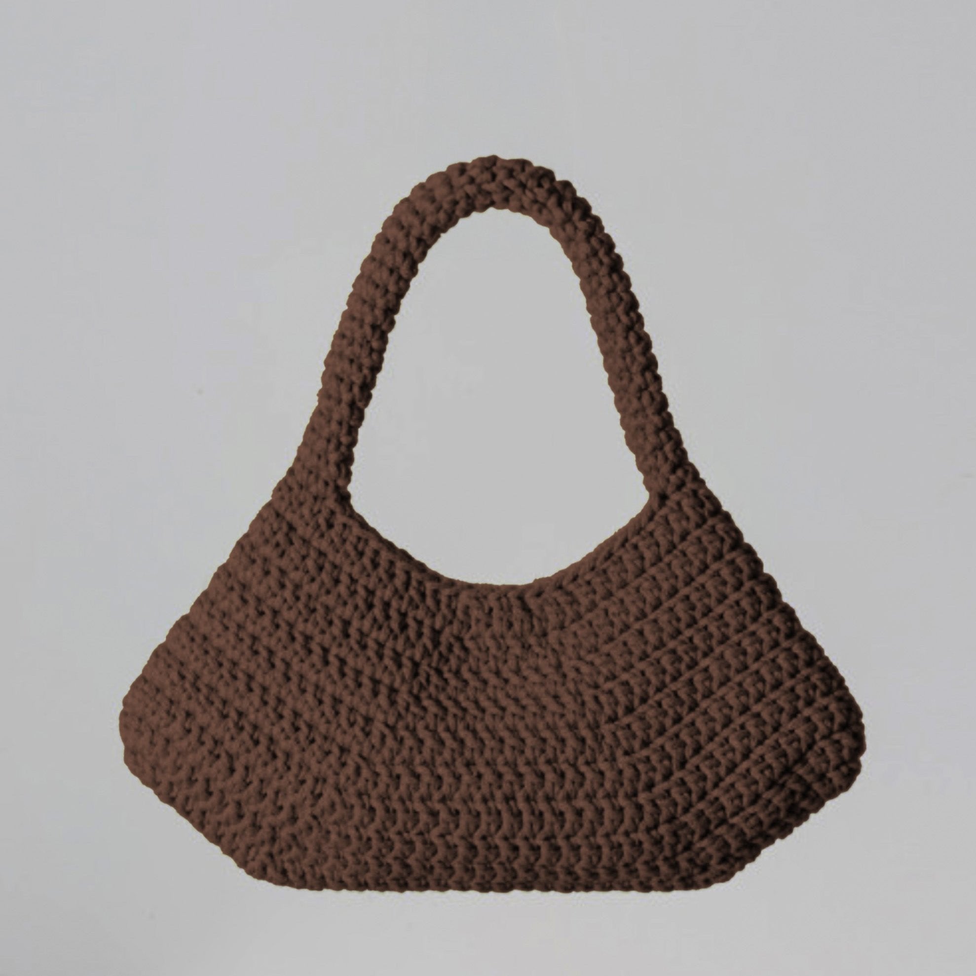 ETTA handmade designer bag in brown, a statement of bespoke luxury and ethical craftsmanship.