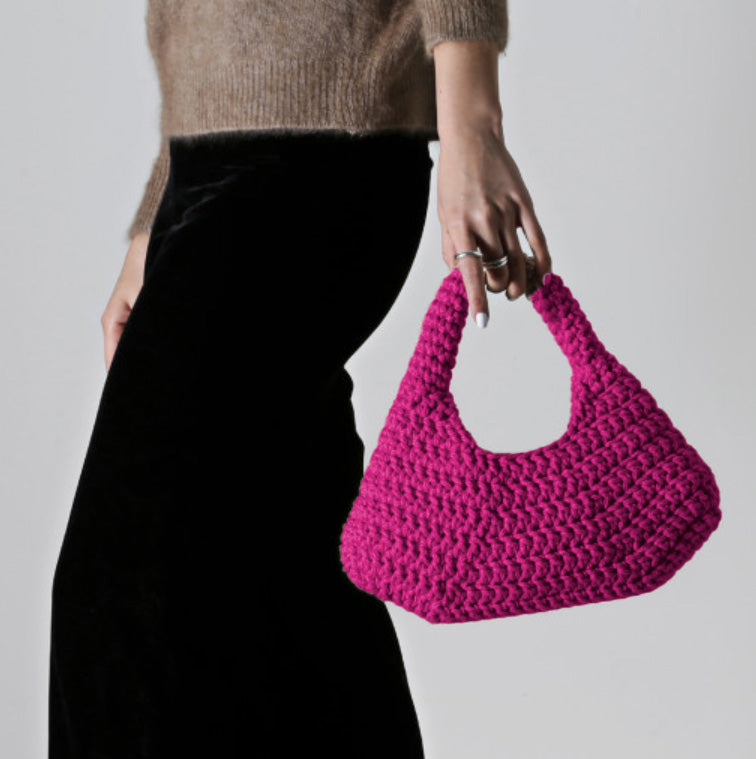 ETTA sustainable luxury bag in rich fuchsia, combining artisanal craftsmanship with premium eco-friendly fashion.