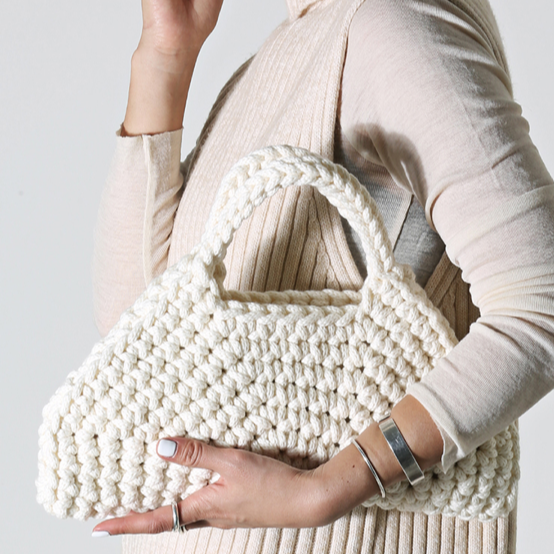 NINA bespoke handbag in refined natural white, ethically crafted for modern, minimalist luxury fashion.