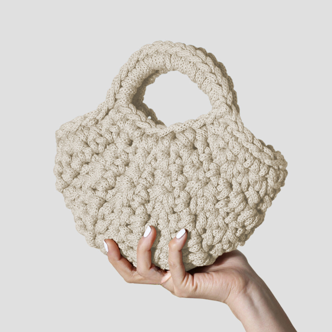 Sade handmade designer bag in natural cream, a statement of timeless elegance and sustainable luxury